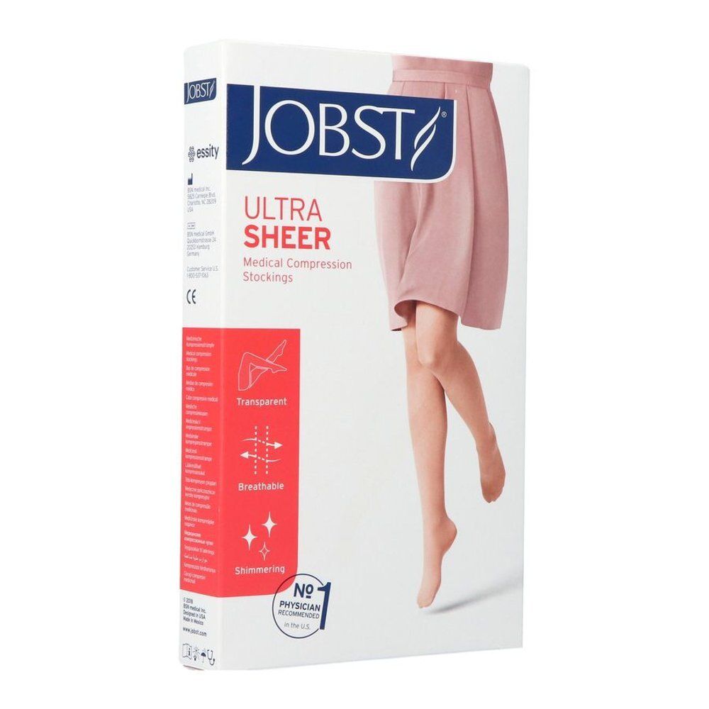 Jobst Ultra Sheer Medical Compression Stockings. Boîte avec bas. Jambe dans bas sur fond blanc.