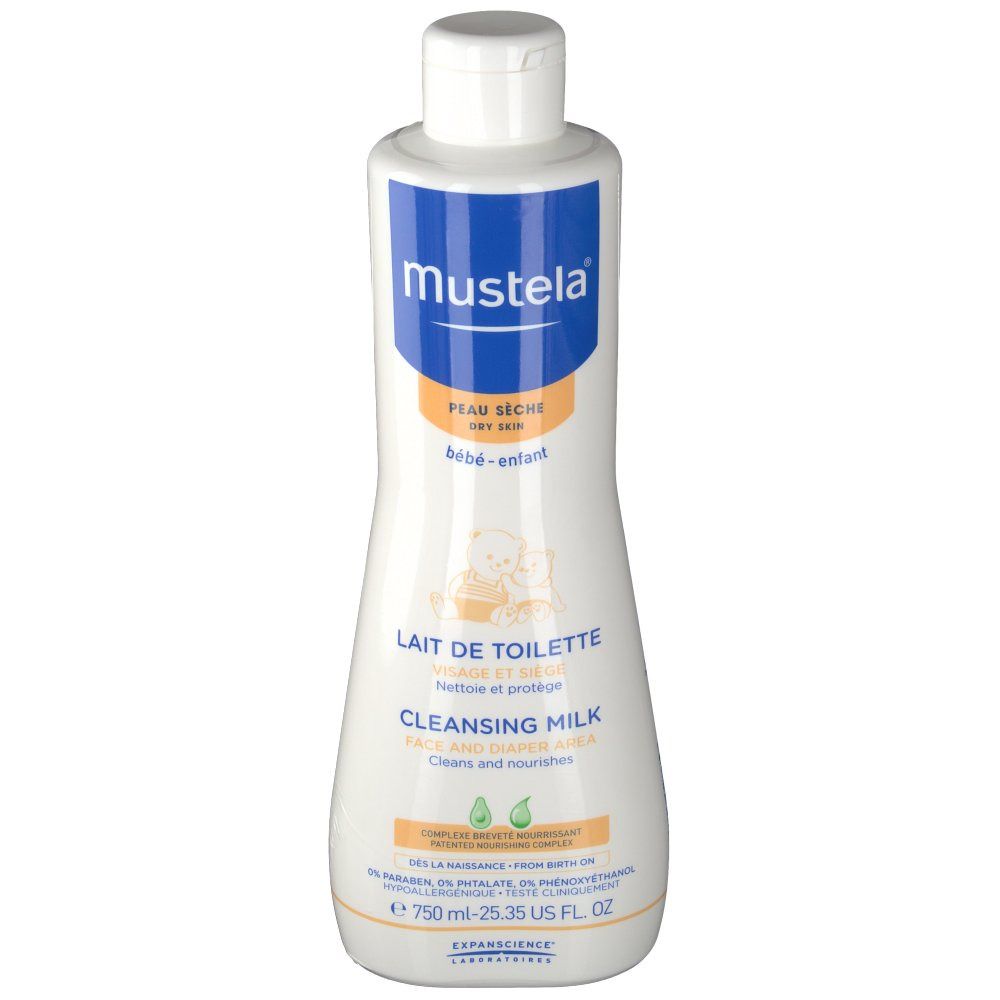 Witte fles met blauw en oranje etiket. Opschrift: mustela, Lait de Toilette, Cleansing Milk. Bevat 750 ml.