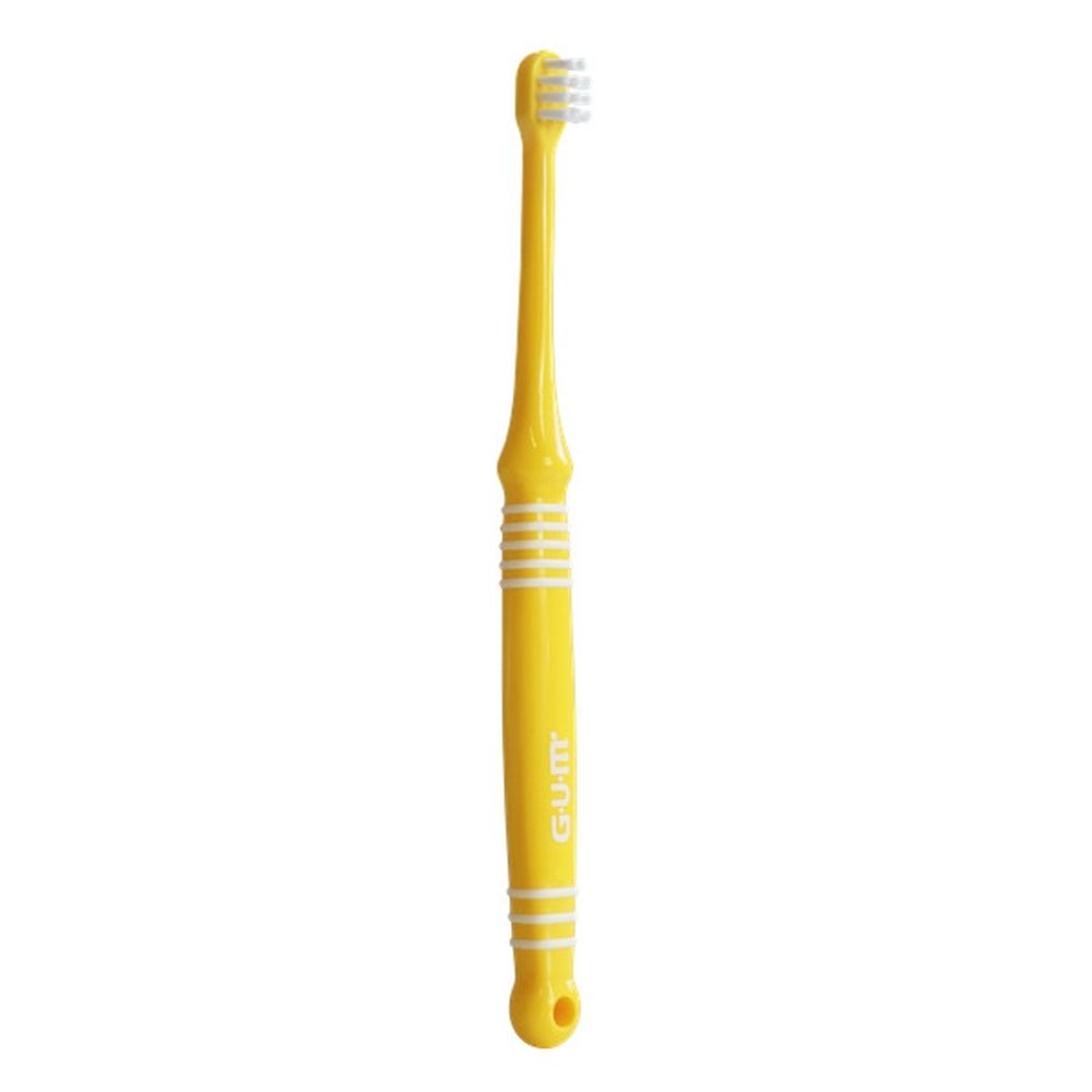 Gele baby-tandenborstel. Merk G.U.M, Baby 0+. Borstelharen, handvat en vorm zichtbaar.