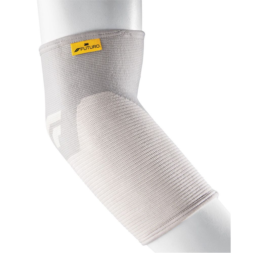 Bandage coude Comfort Lift Futuro™, taille L. Boîte noire avec image du produit et texte multilingue.