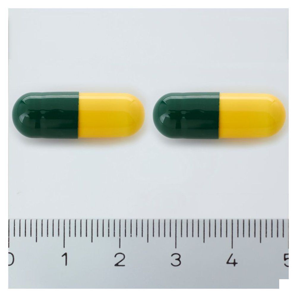 Twee geel-groene capsules. Liniaal voor schaal.