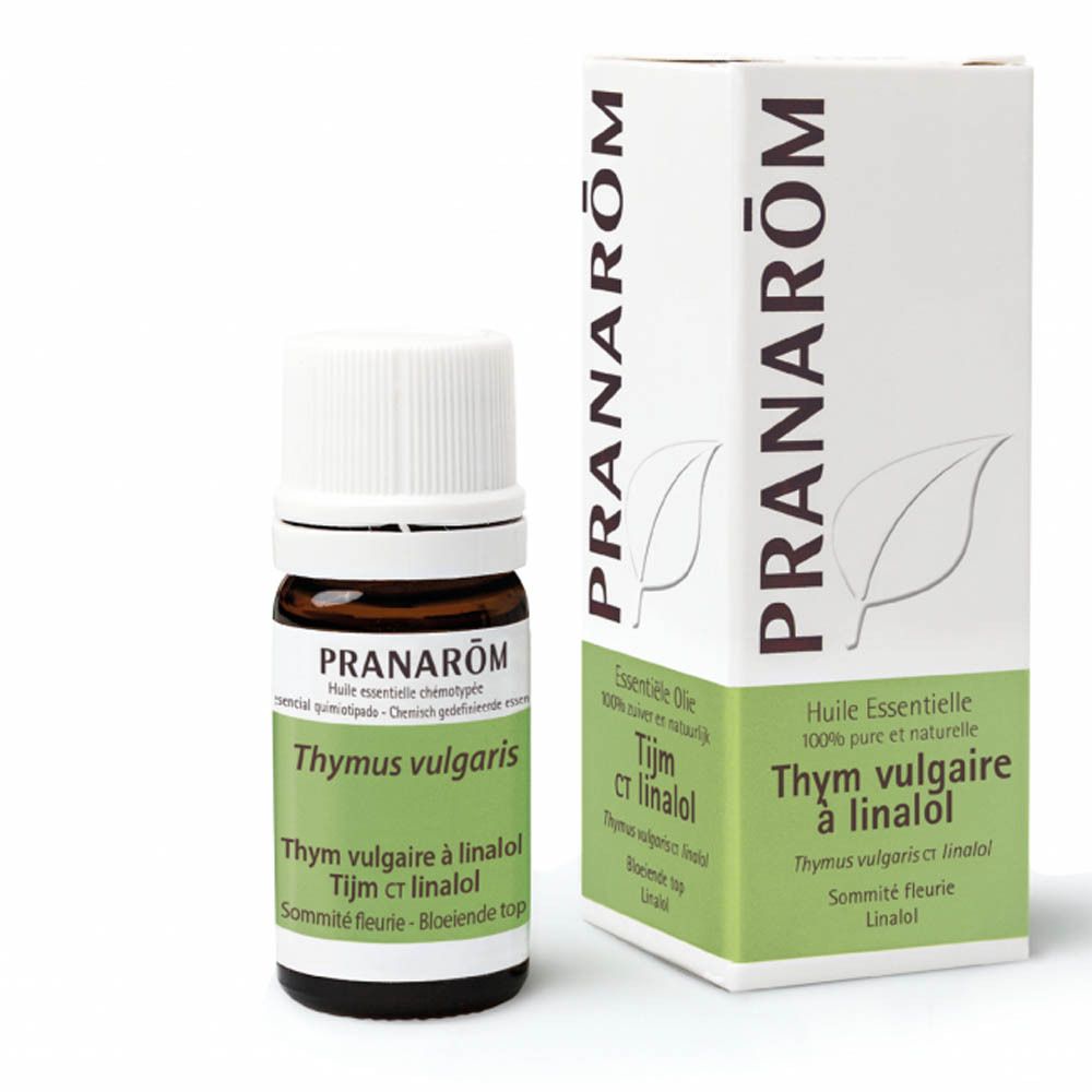 Bruine glazen fles met witte dop en doos. Opschrift: PRANAROM, Thymus vulgaris, Tijm ct linalol.