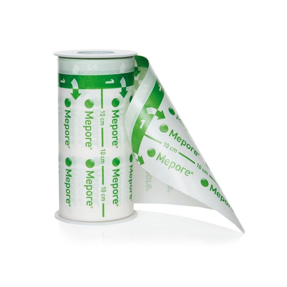 Rouleau de pansement transparent. Inscriptions : Mepore, 10 cm. Flèches et chiffres verts. Partiellement déroulé.