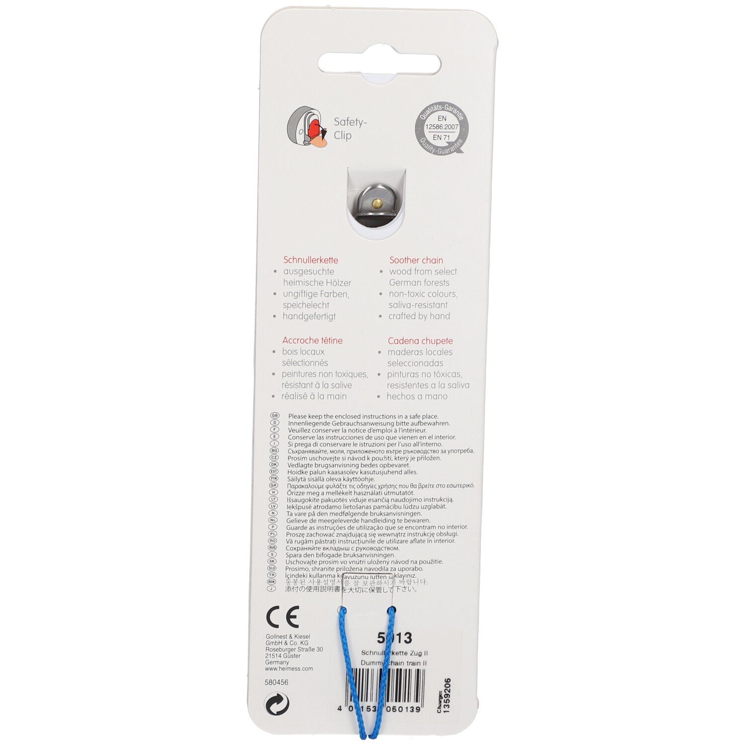 Dos de l'attache-tétine HEIMESS. Avec clip de sécurité. Texte en allemand, anglais, français, italien. Marquage CE.