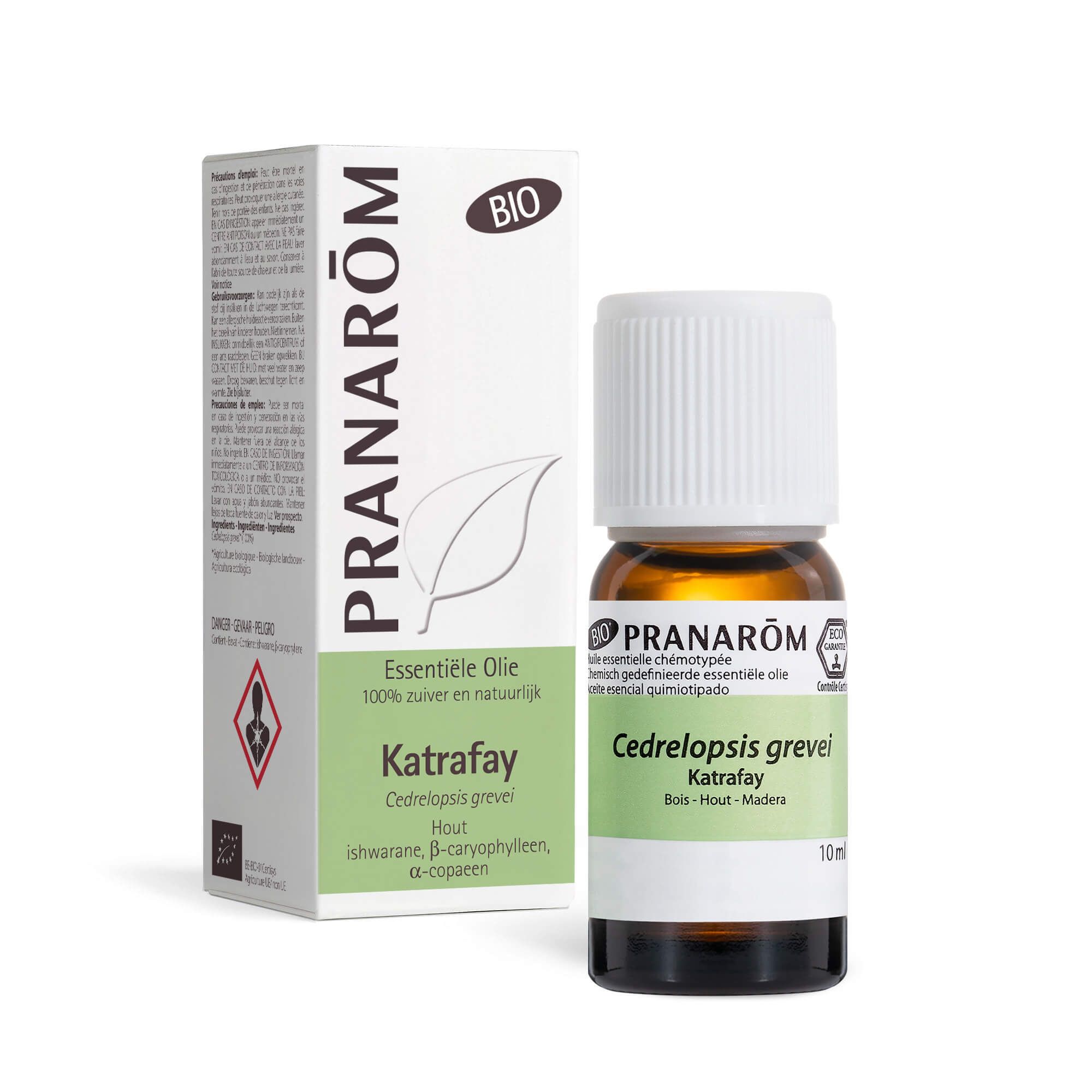 Bruine glazen fles met witte dop. Kartonnen verpakking met productnaam en merk.