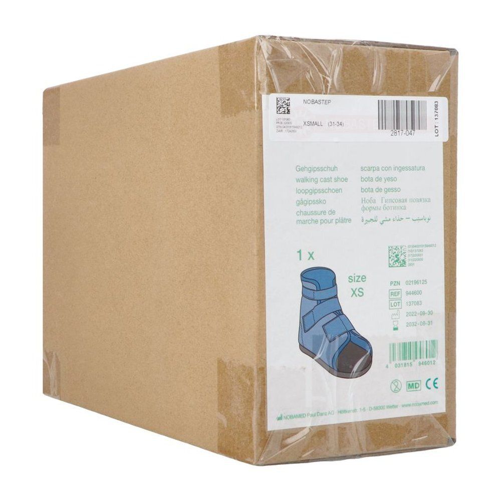 Boîte en carton avec NOBASTEP® Gehschuh XS. Étiquette avec informations produit et illustration de la chaussure. Taille XS.
