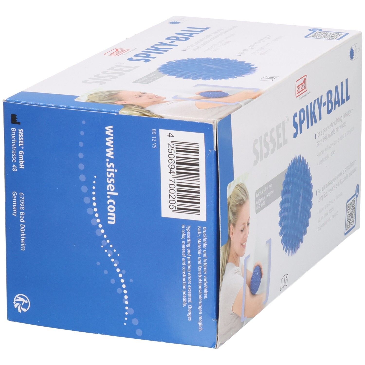 Boîte Sissel Spiky-Ball. Balle de massage bleue. Impression: www.sissel.com, code-barres, adresse. Femme avec balle. Texte en allemand.