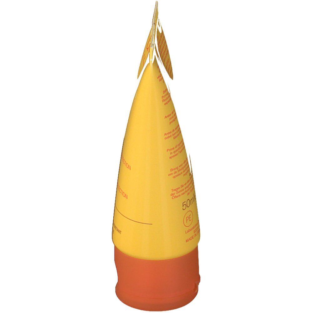 Tube jaune, bouchon orange. Informations produit sur le tube.