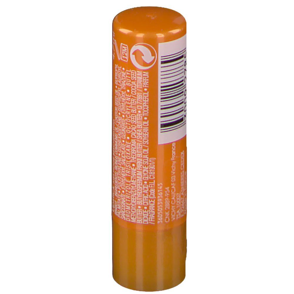 Achterkant van een oranje lippenstiftstick. Streepjescode en tekstinformatie.