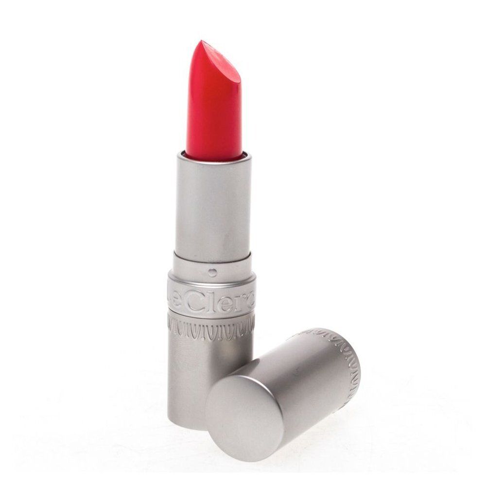 Een rode lipstick in zilveren huls, dop ernaast.