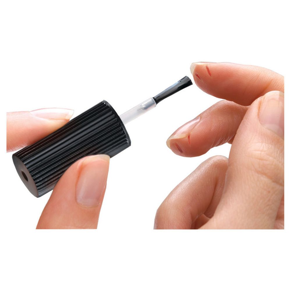 Verpakking van Nexcare Skin Crack Care. Fles met applicator, 7 ml. Oranje-wit ontwerp met productnaam.