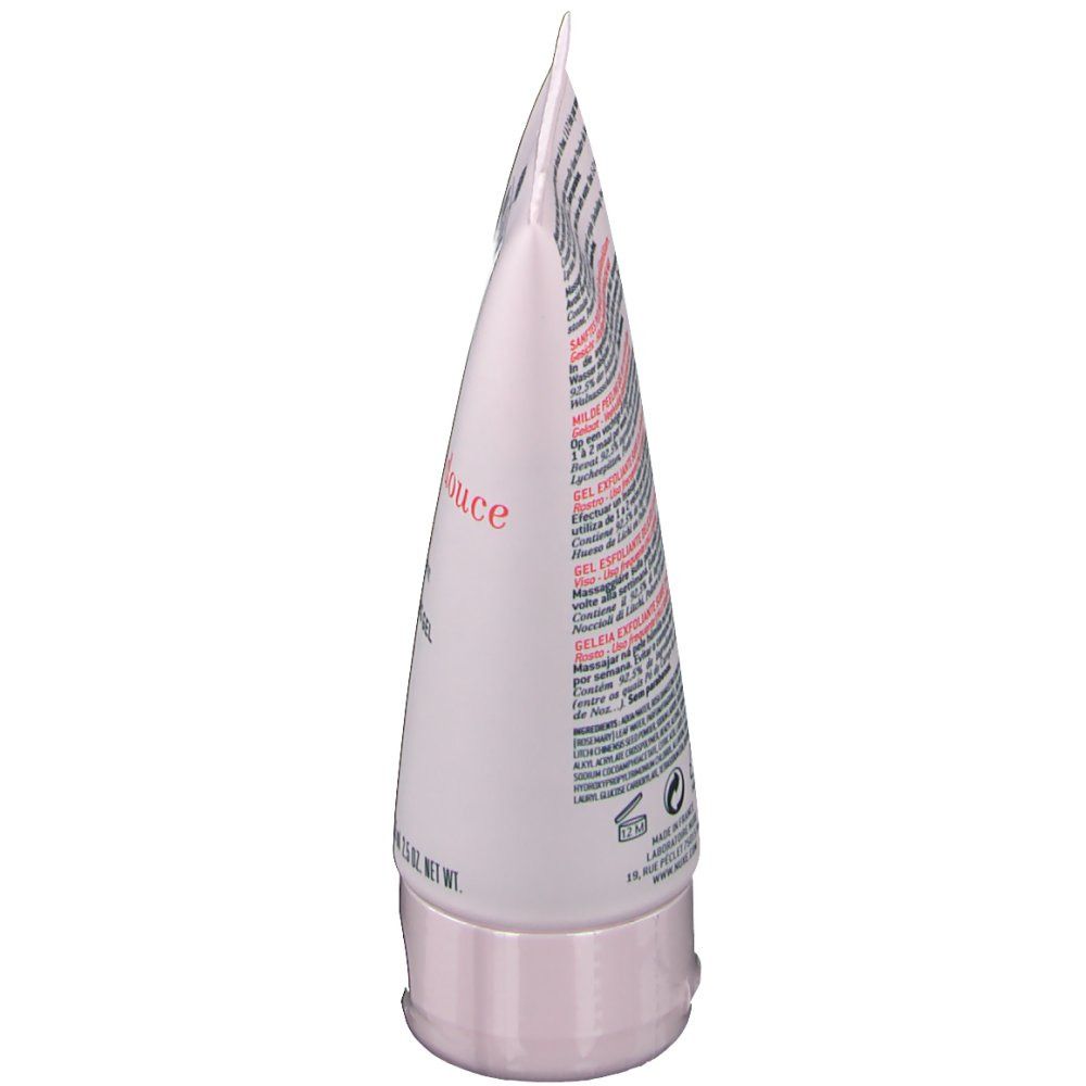 Zijaanzicht van de tube. Roze tube met tekst. Gelée exfoliante douce. Zachte peelinggel met rozenblaadjes. Voor de gevoelige huid.