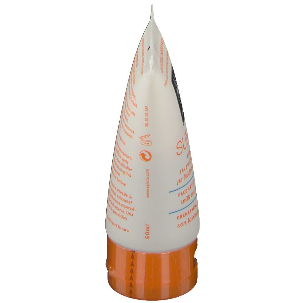 Vue latérale de l'extrémité du tube. Bouchon orange. Informations produit sur fond blanc.