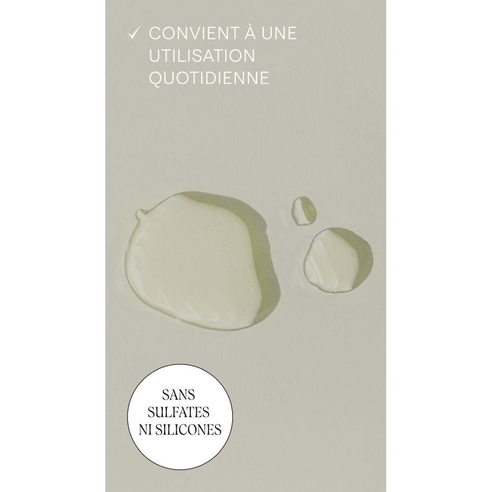 Gouttes d'huile. Texte: Convient à une utilisation quotidienne. Sans sulfates ni silicones.