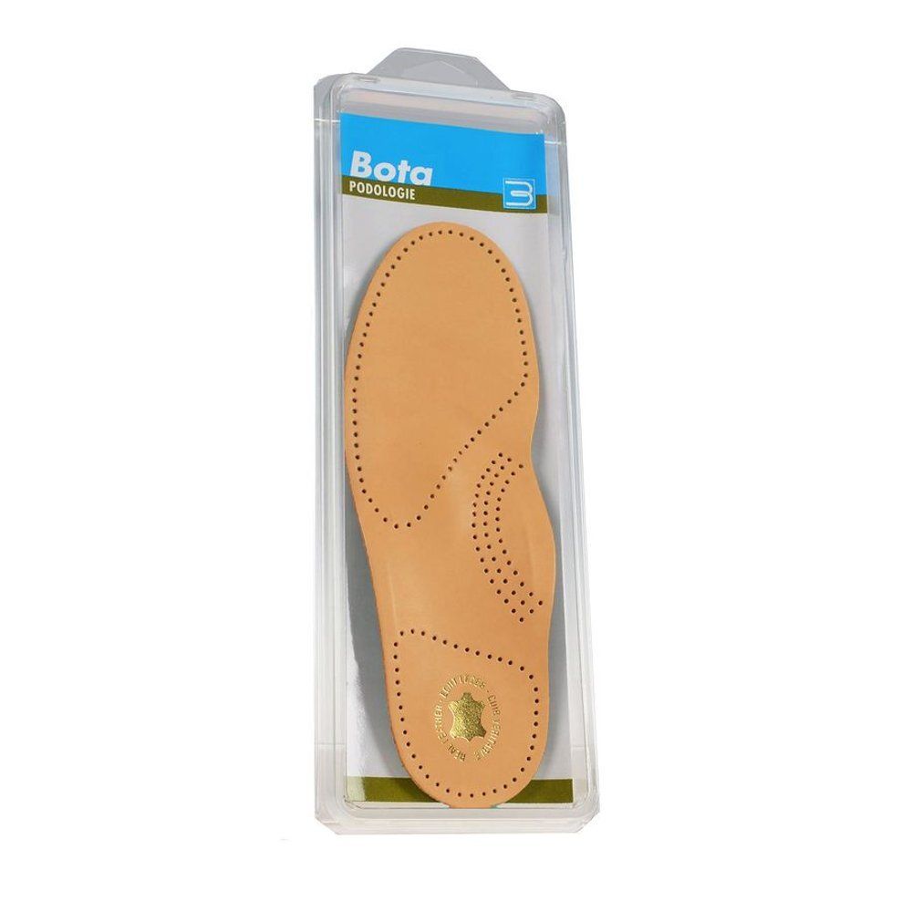 Verpakking met een beige inlegzool. Transparante plastic verpakking. Bota Podologie.