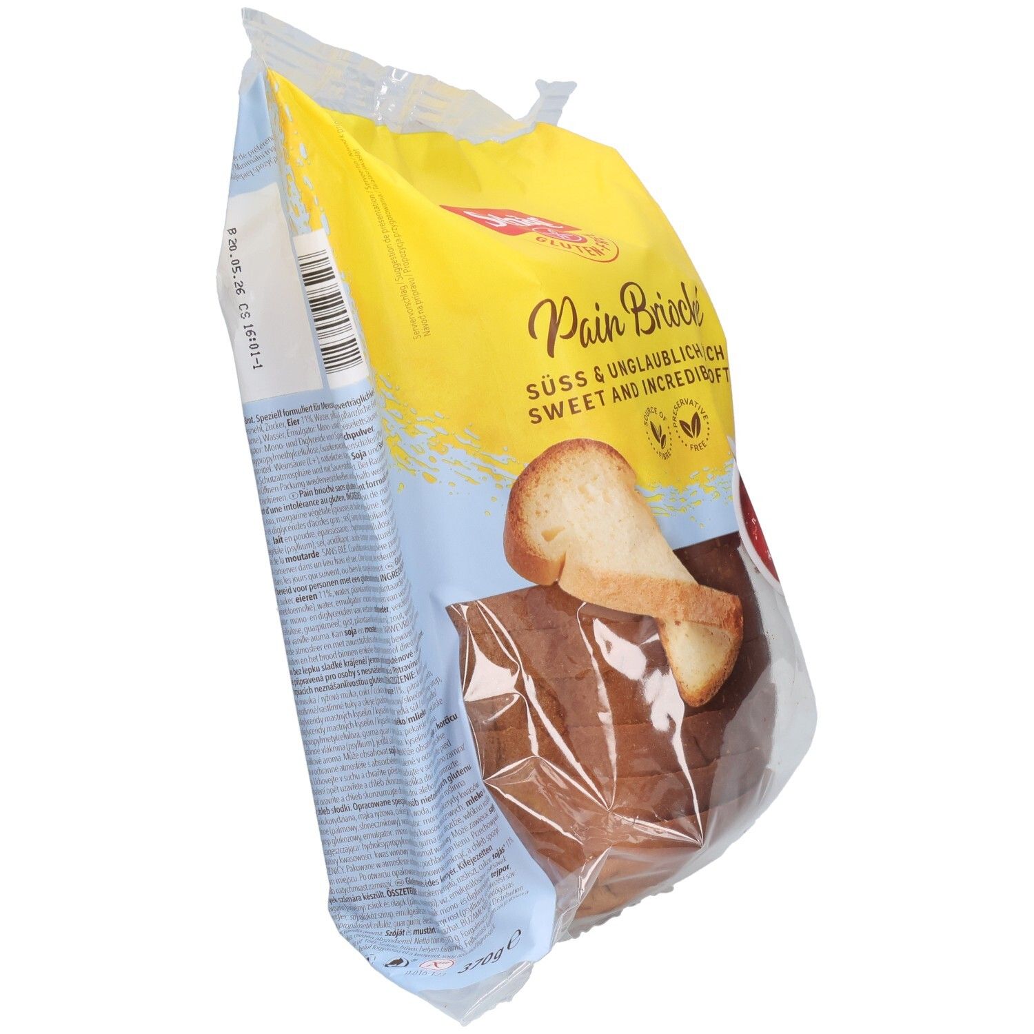 Emballage de pain brioché sans gluten Schär. Emballage jaune et bleu avec illustration de pain. Morceaux de pain visibles.