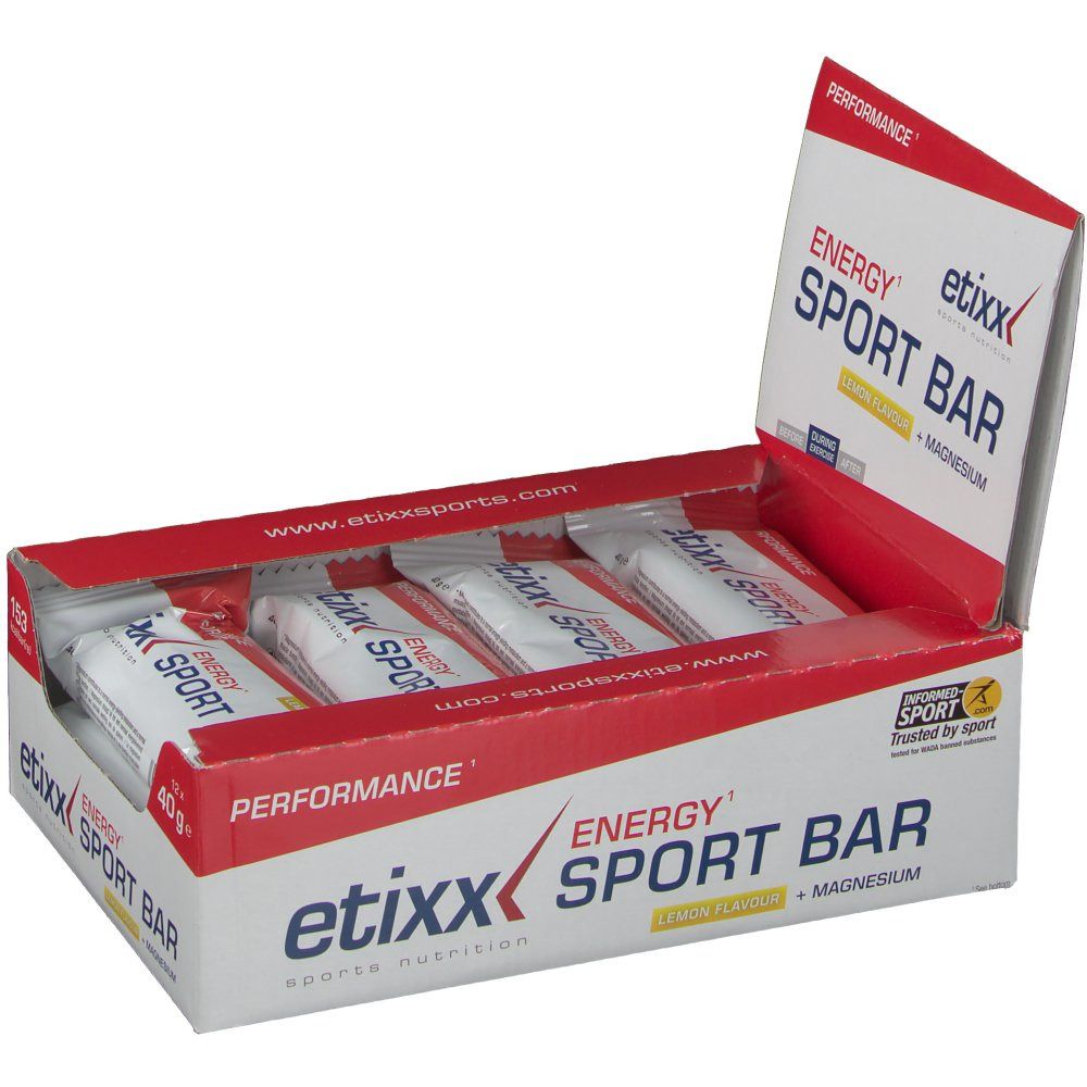 Boîte ouverte avec Etixx Energy Sportbar Lemon. Emballage rouge et blanc avec nom et logo du produit. Barres individuelles visibles.