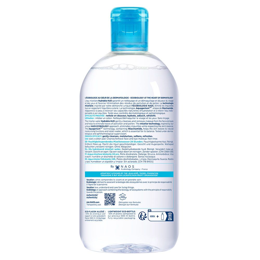 Achterkant van de fles. Meertalige tekst. QR-code en logo's. Fles met blauwe dop.