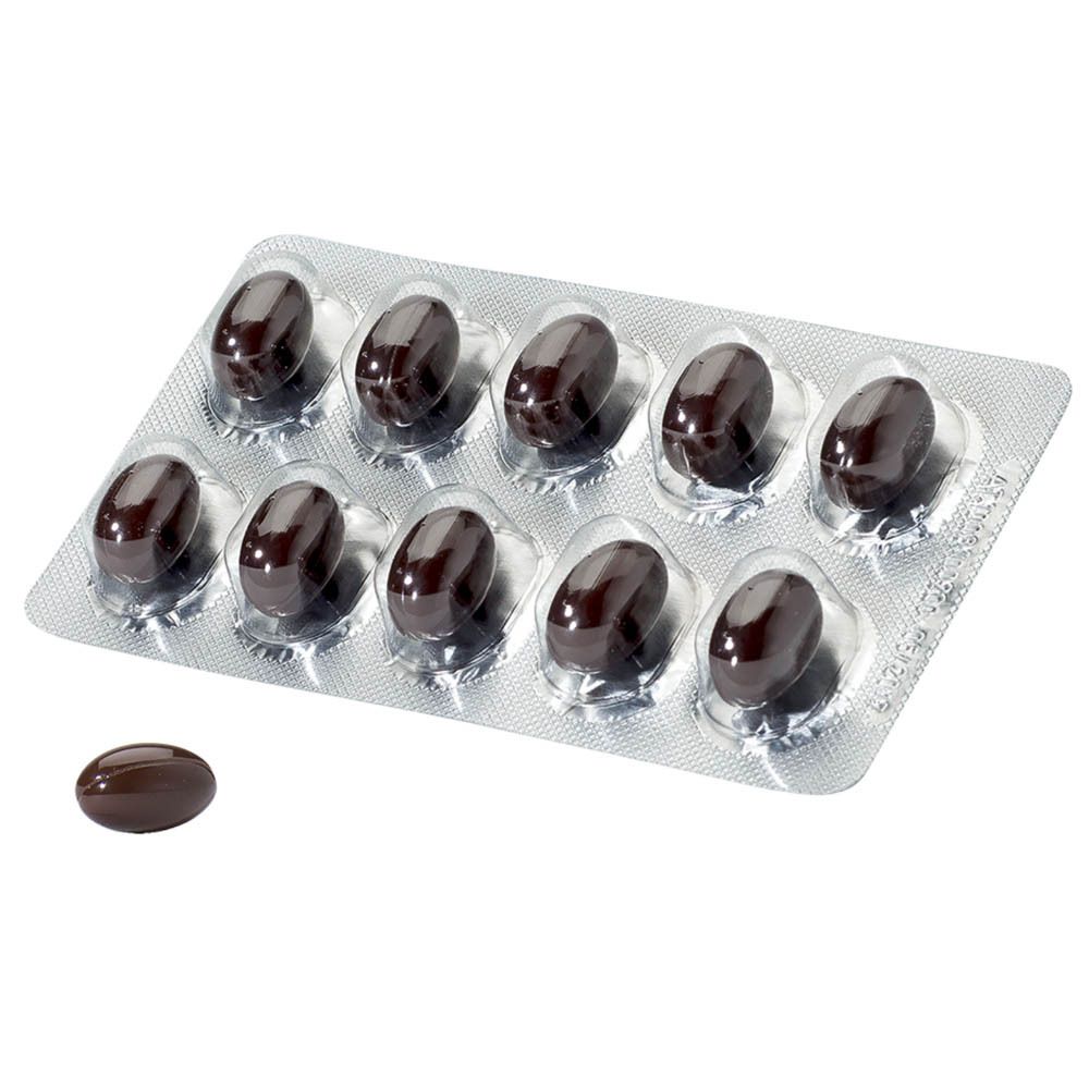 Blister de gélules brunes. Une gélule à côté.