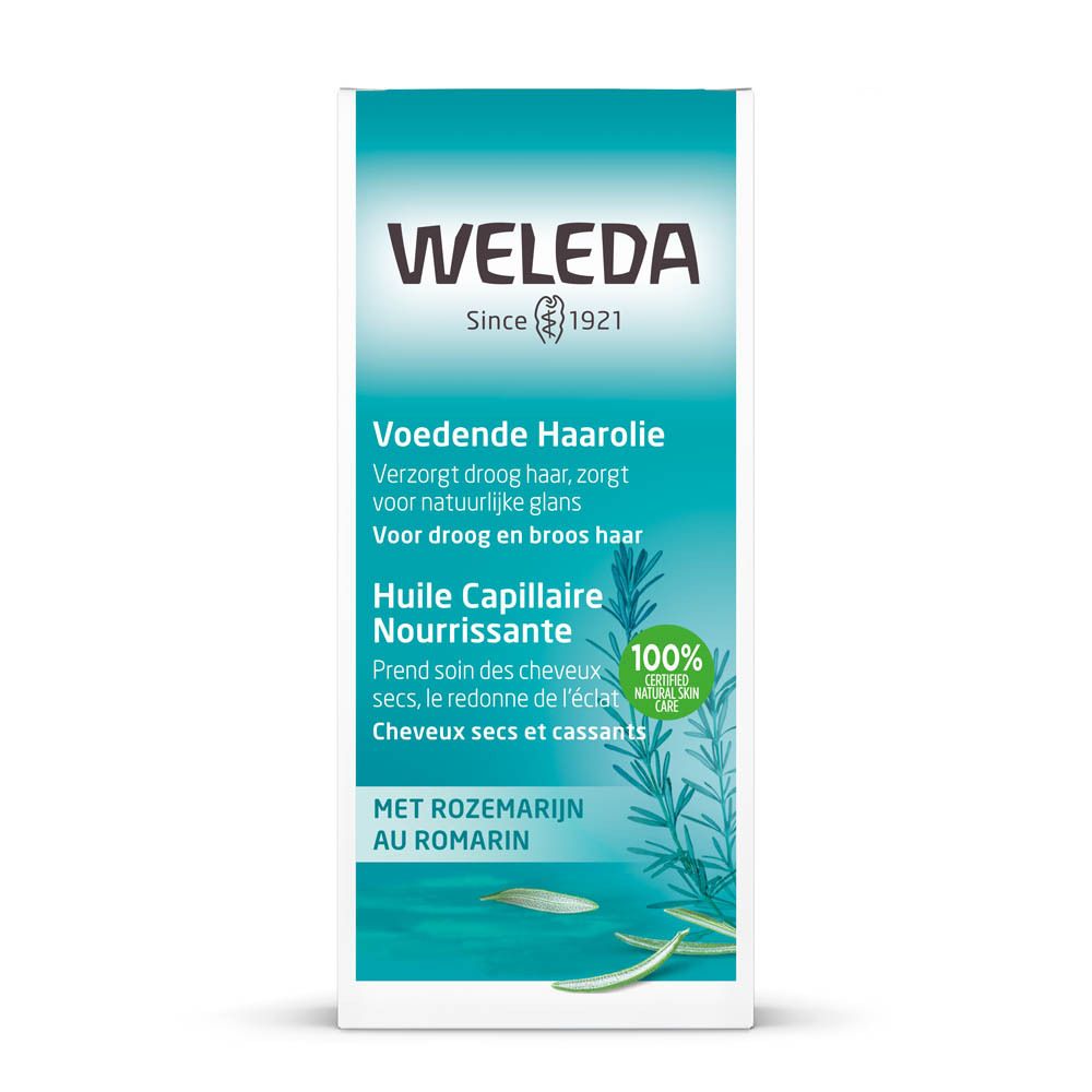 Witte verpakking met opschrift: WELEDA, Voedende Haarolie, 1.7 FL OZ (50ml). Met certificering.