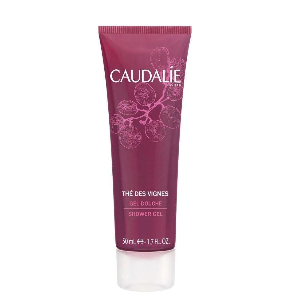 Roze en witte tube met CAUDALIE-logo en productnaam. Opschrift: Thé des Vignes, Gel Douche, Shower Gel. 50 ml.