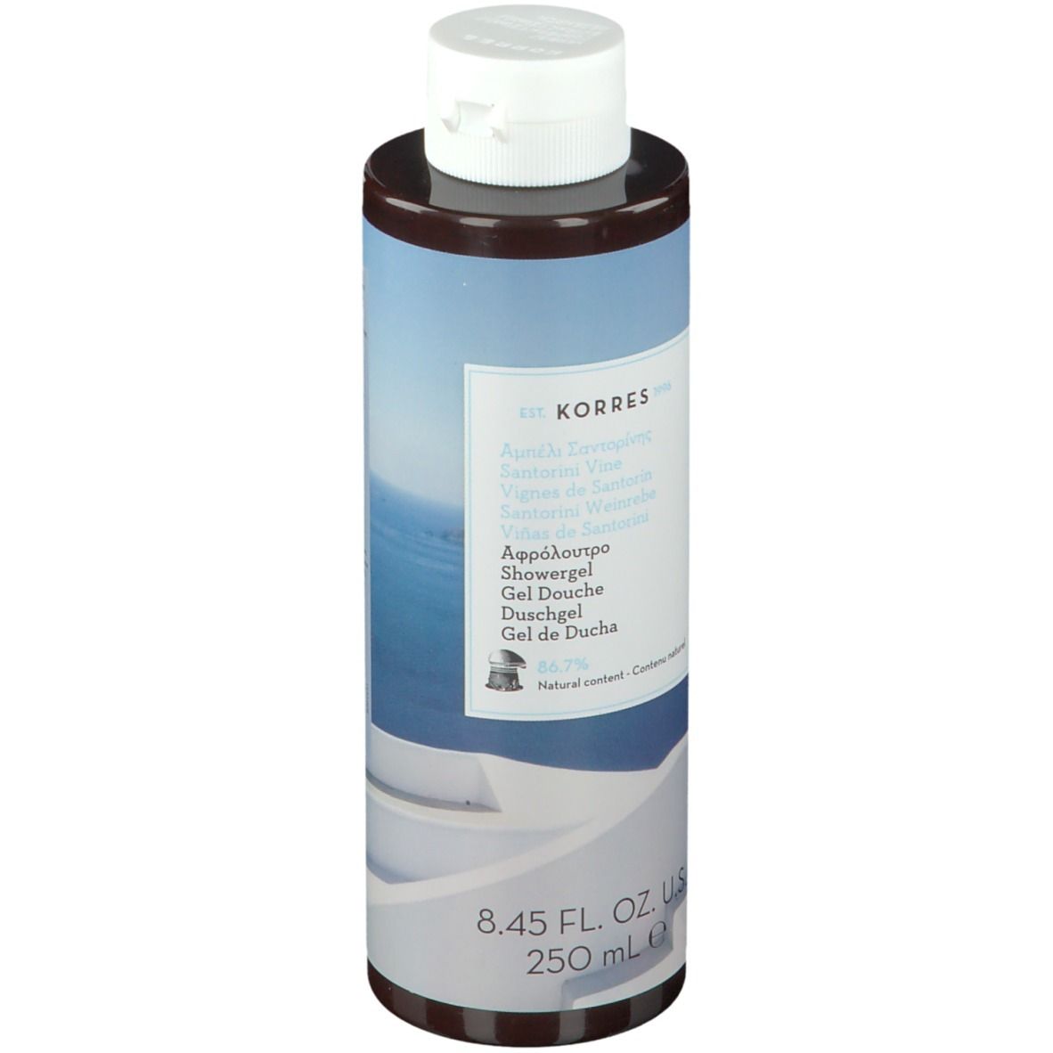 Gel douche KORRES Santorini. Flacon cylindrique avec bouchon blanc. Étiquette avec nom et informations.