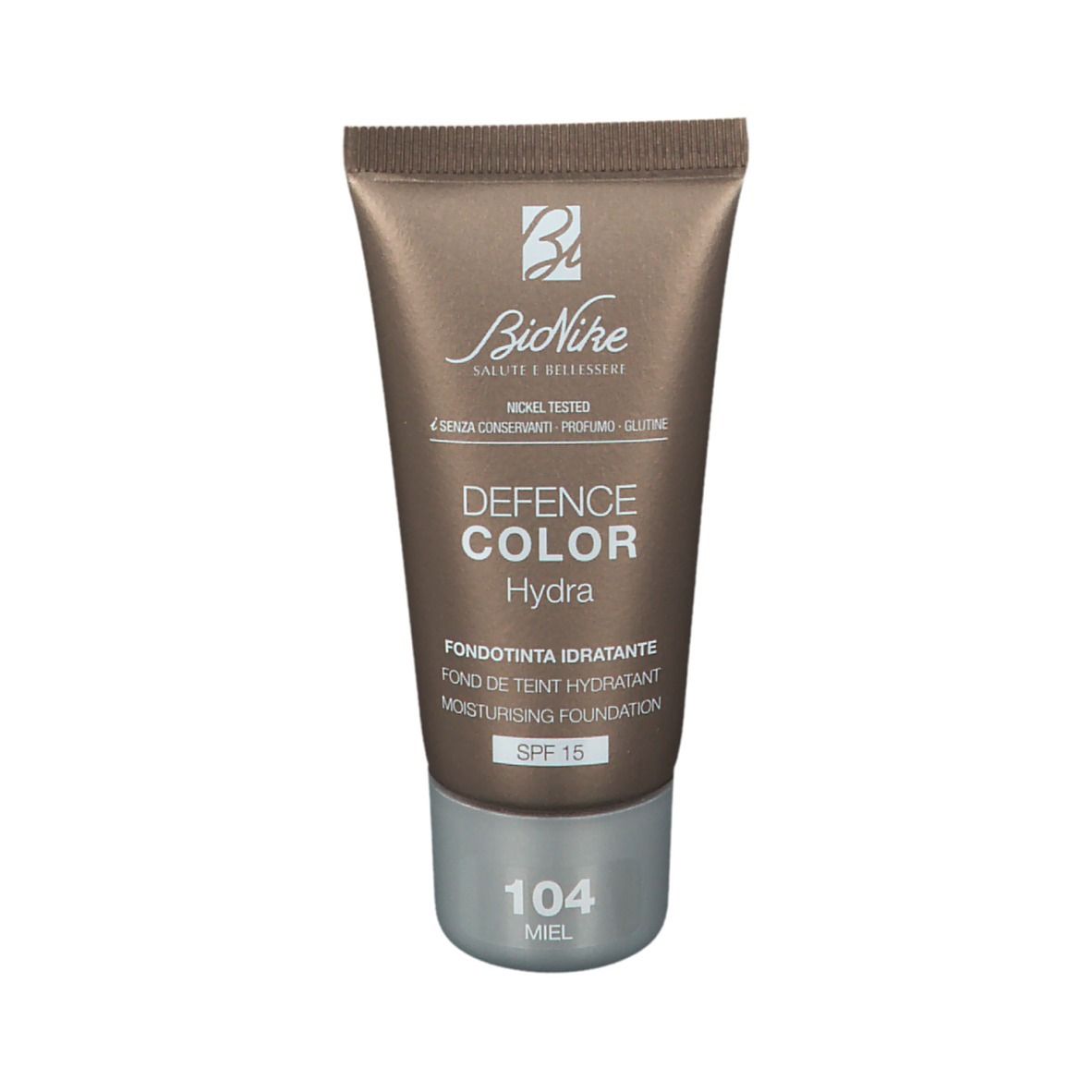 Bruine foundation tube. Merk BioNike, Defence Color Hydra. Tint 104 Miel. Met SPF 15. Getest op nikkel.