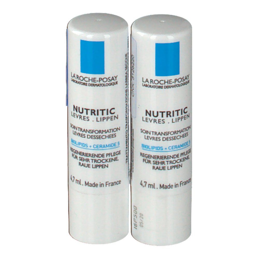 Deux sticks de soin pour les lèvres. Blancs avec capuchon bleu. Inscription: La Roche-Posay, Nutritic Levres, Biolipids + Ceramide 3. Fabriqué en France.