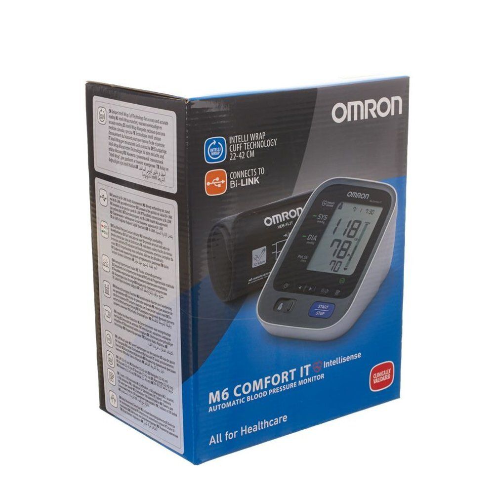 Verpakking van Omron M6 Comfort IT bloeddrukmeter. Toont apparaat en manchet. Met display en merknaam.