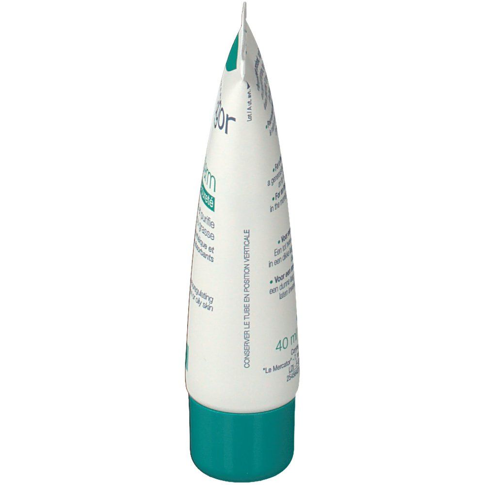 Vue latérale du tube de crème. Emballage blanc et vert. Texte en français et anglais.