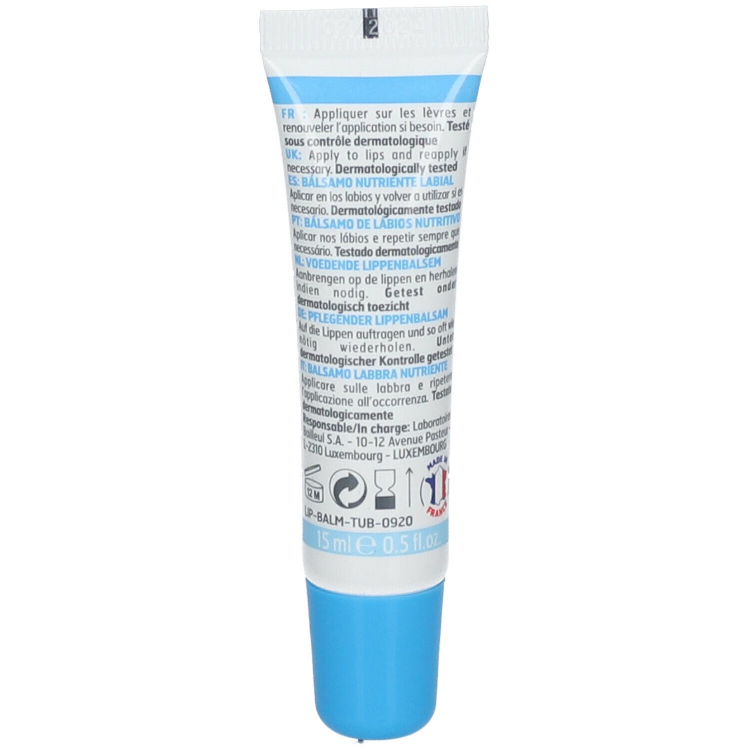 Dos du tube de baume à lèvres. Texte multilingue. Contient des informations sur l'utilisation et les ingrédients. 15 ml.