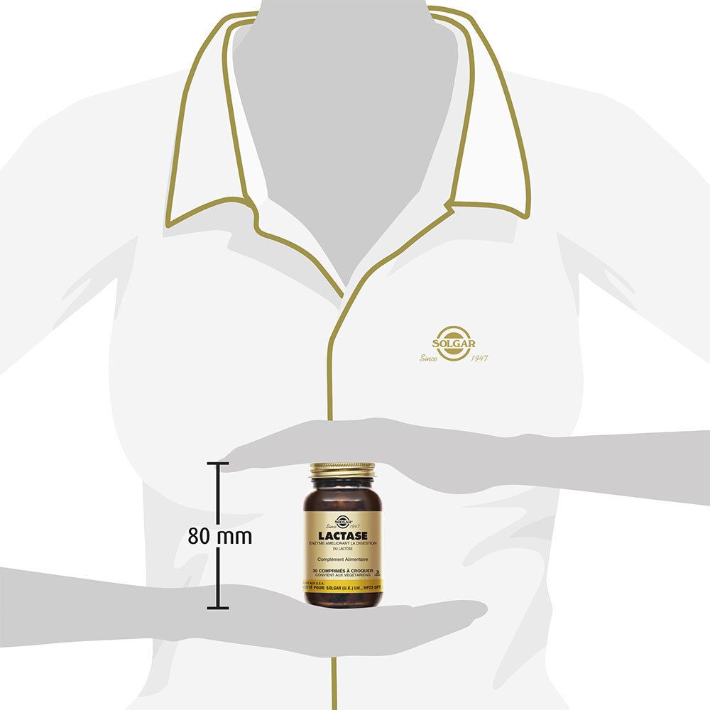 Flacon en verre brun avec couvercle doré et étiquette. Une main tient le flacon. Dimensions : 80 mm.