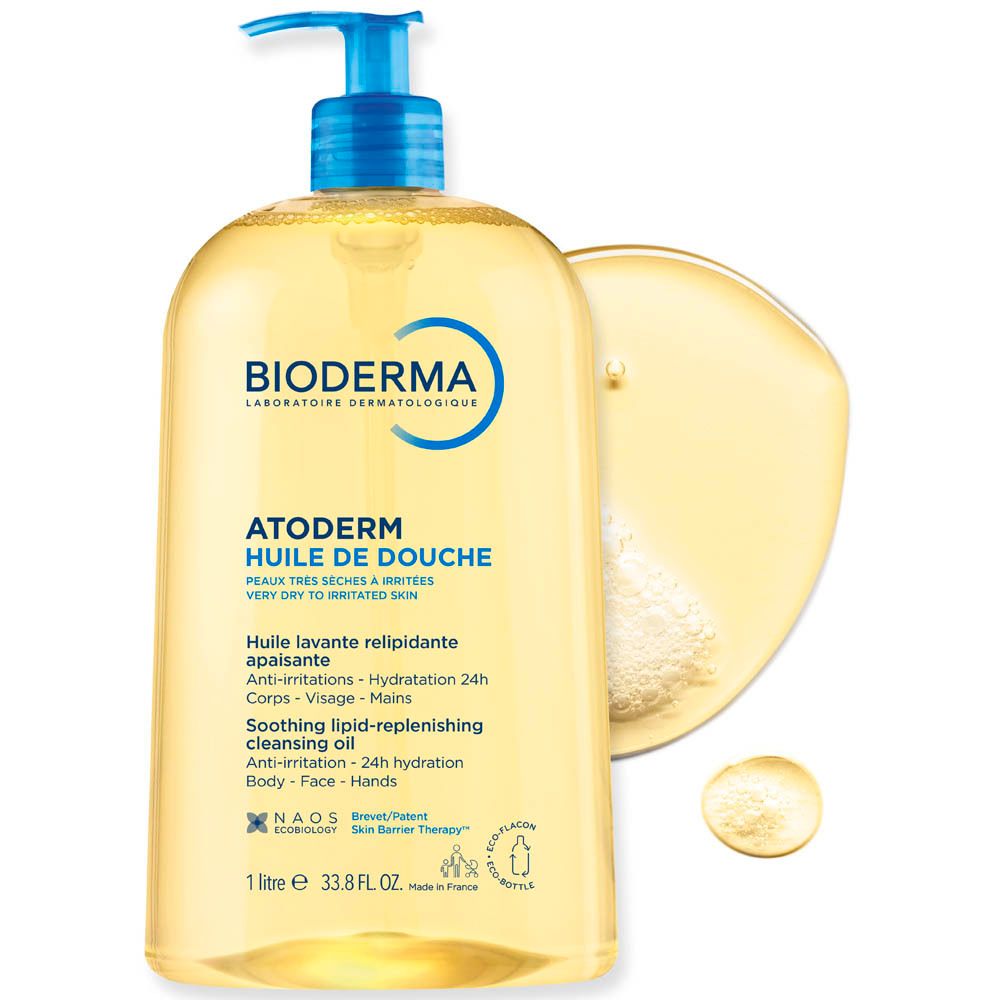 BIODERMA Atoderm Huile de douche fles met olievlek. Gele vloeistof, blauwe pomp. Tekst: Atoderm, Huile de douche.