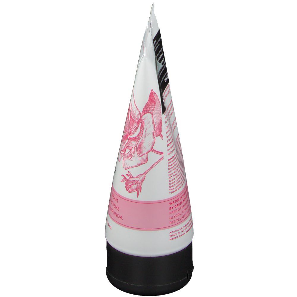 Tube blanche et rose avec bouchon noir. Impression avec motif floral et texte. Vue d'en bas.