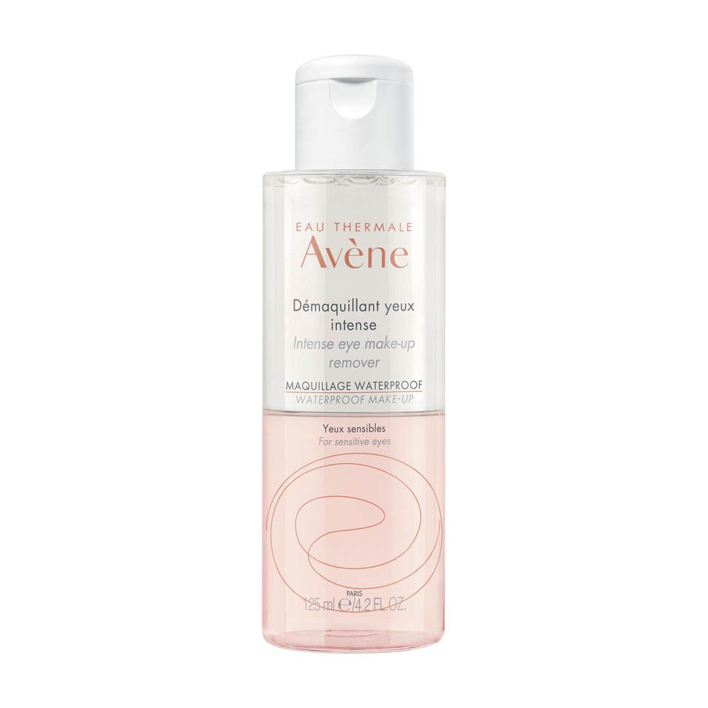 Transparante fles Avène Démaquillant yeux intense met witte dop. Roze vloeistof. Tekst: Intense eye make-up remover.