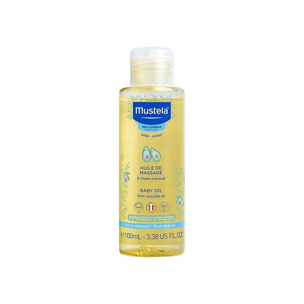 Flacon d'huile Mustela® pour bébé. Liquide jaune, bouchon blanc. Étiquette avec illustrations d'avocats et informations.
