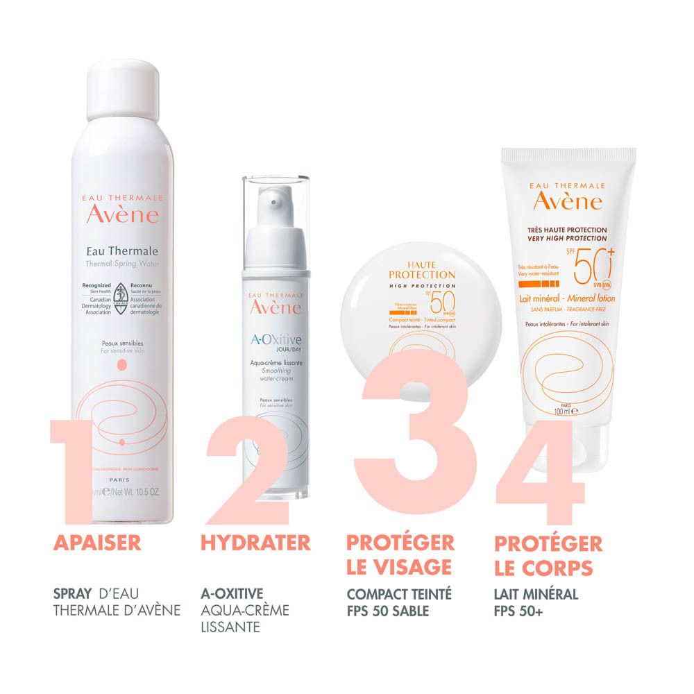 Emballage blanc avec écriture orange. Texte : HAUTE PROTECTION, SPF 50, Compact teinté.