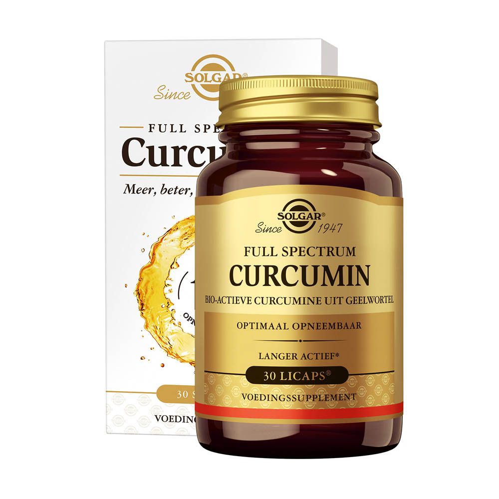 Bruine fles met gouden dop en twee rode capsules op een boek. Productnaam en merk op het etiket.