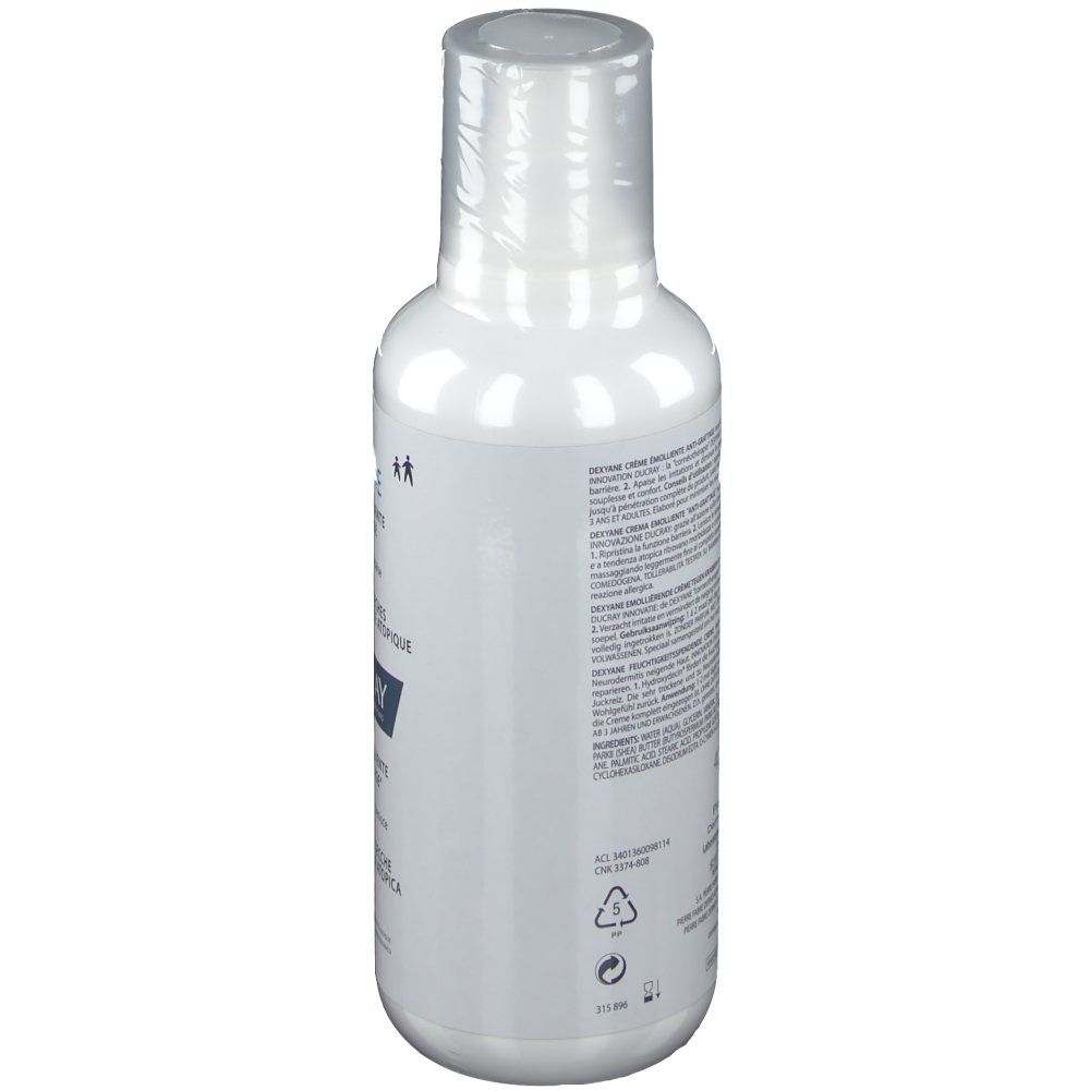 Witte fles met tekst. Achteraanzicht. DUCRAY DEXYANE crème. Tekst in het Frans en Italiaans.