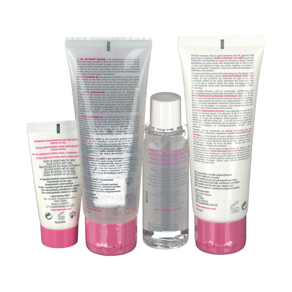 Vue arrière de quatre produits cosmétiques. Tubes blancs avec accents roses. Texte et informations sur le produit visibles.