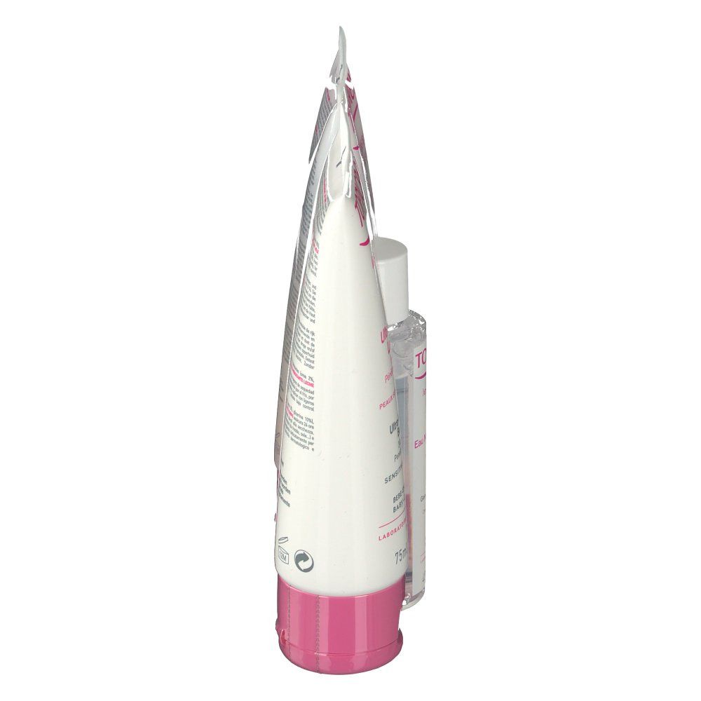 Vue latérale d'un tube cosmétique. Tube blanc avec accents roses. Produit debout.