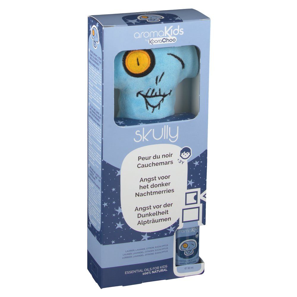 Productverpakking met blauwe knuffel in schedelvorm. Gedrukte schedel met gele oog. Productnaam en teksten in verschillende talen.