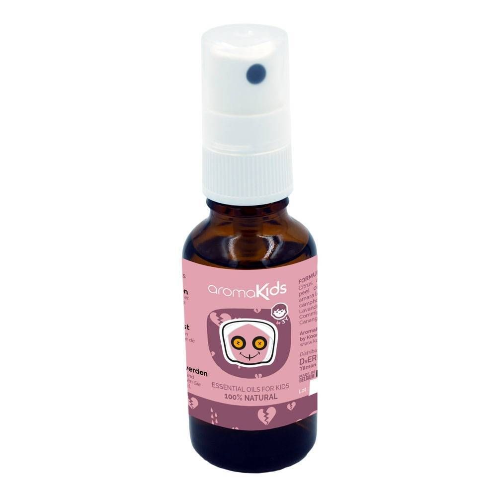 Flacon en verre brun avec vaporisateur blanc et étiquette rose. Nom du produit et illustrations visibles.