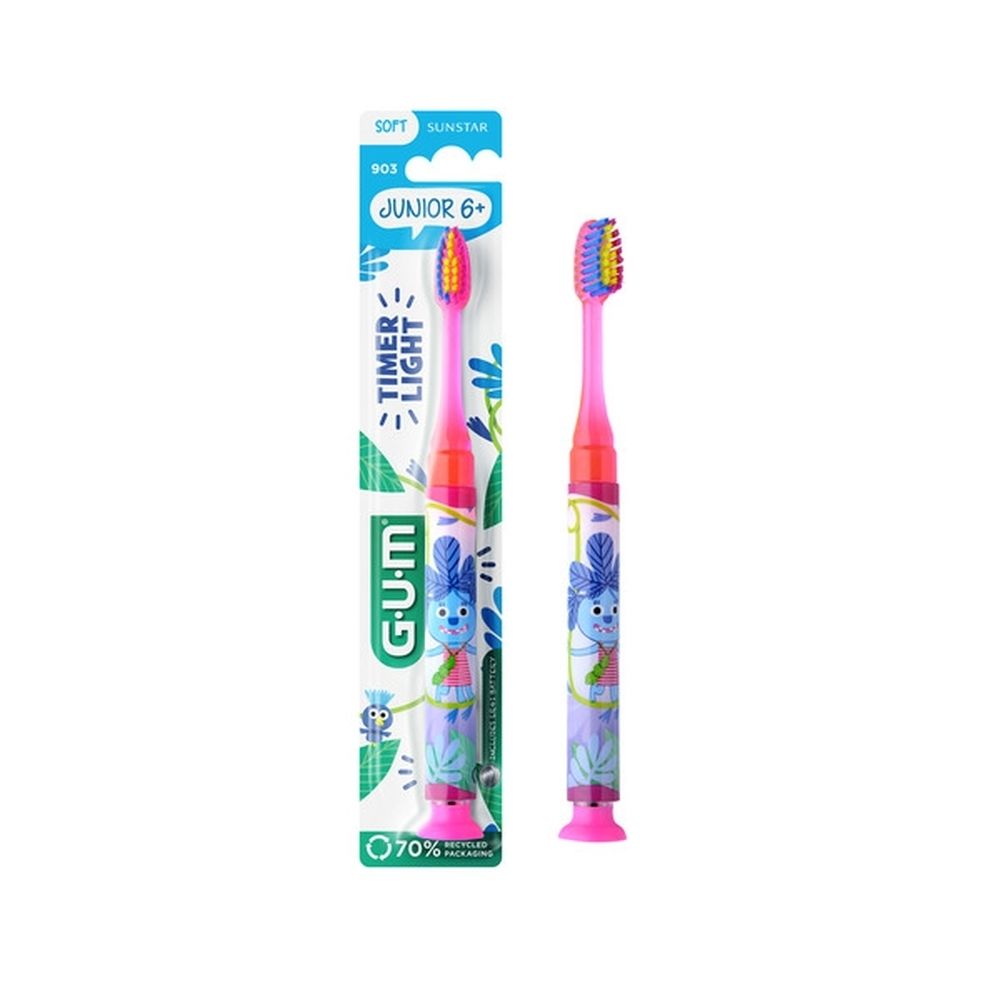 Brosse à dents GUM Junior. Brosse rose avec poils multicolores. Emballage avec nom et marque.