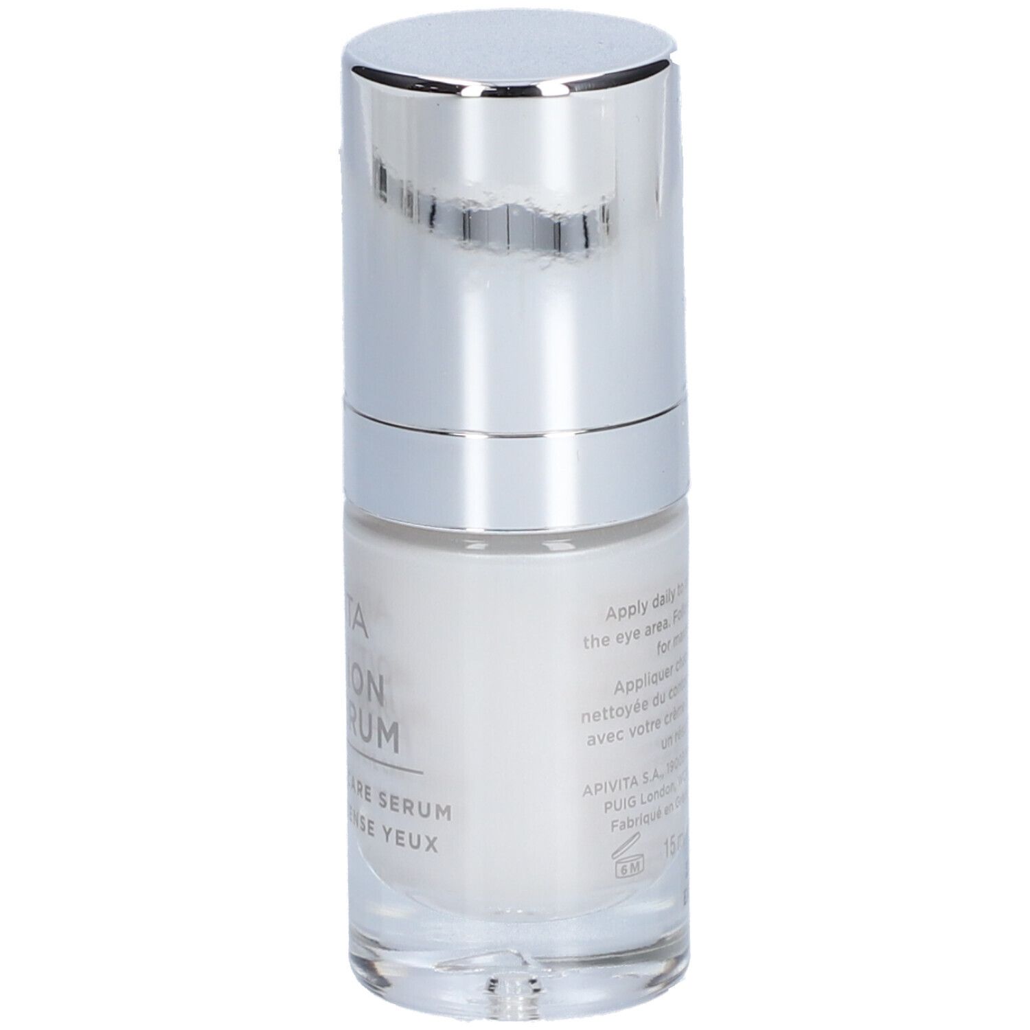 Sérum contour des yeux blanc dans un flacon en verre avec distributeur argenté.
