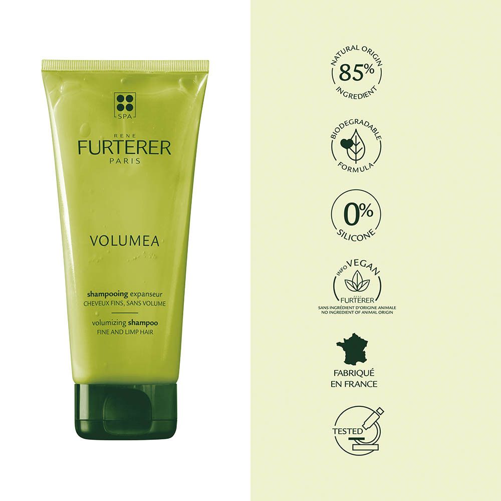 Tube verte de shampoing René Furterer Volumea, avec logos pour ingrédients naturels et formule végane.