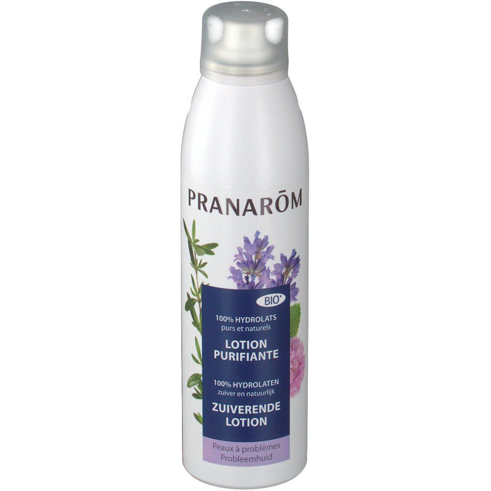 Witte fles met zilveren dop. Opschrift: PRANAROM, Lotion Purifiante, Bio-label. Afbeelding van bloemen en bladeren.