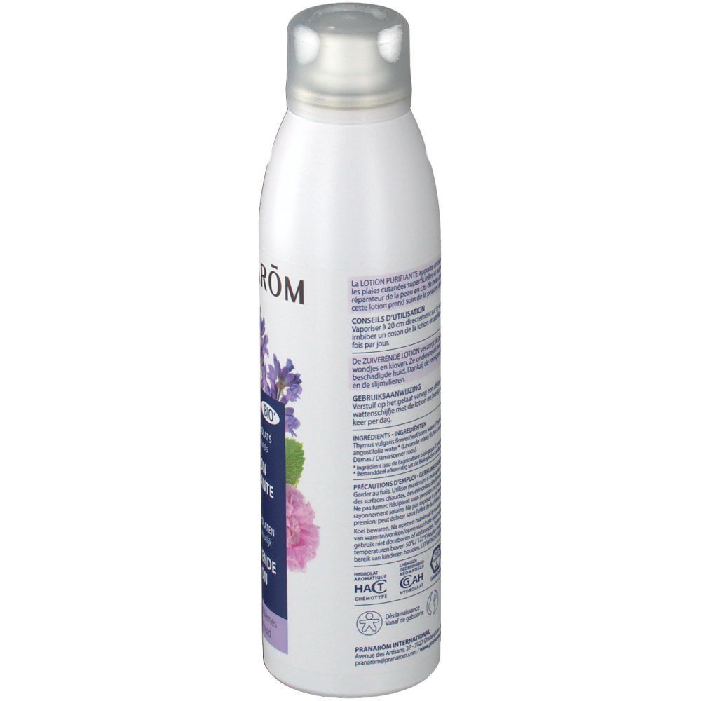 Witte fles met zilveren dop. Achterkant met tekst in meerdere talen. Bio-label en andere certificeringen.