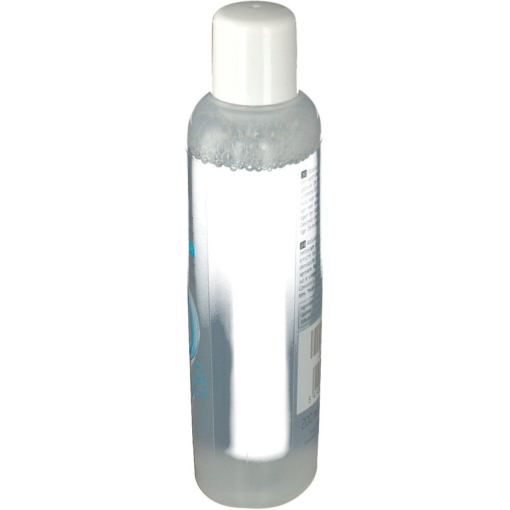 Transparante fles met witte dop. Etiket met tekst en barcode op de achterkant.