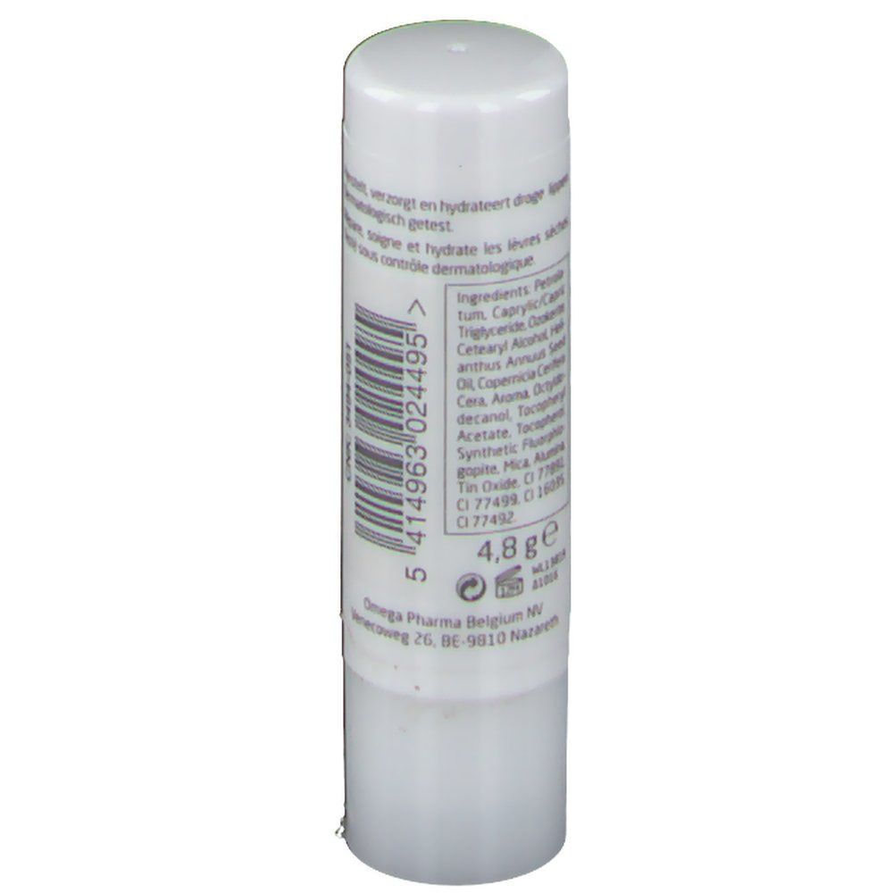 Witte lippenstift. Achterkant met ingrediënten, barcode en fabrikantgegevens.